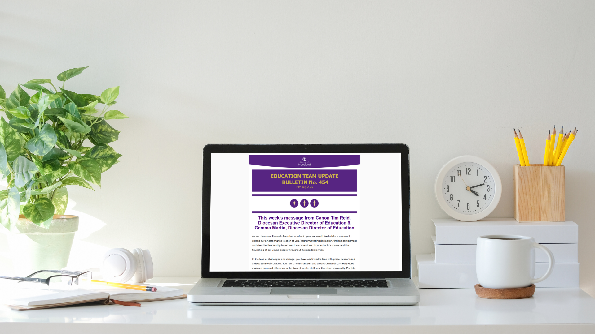 A laptop with the newsletter on the screen