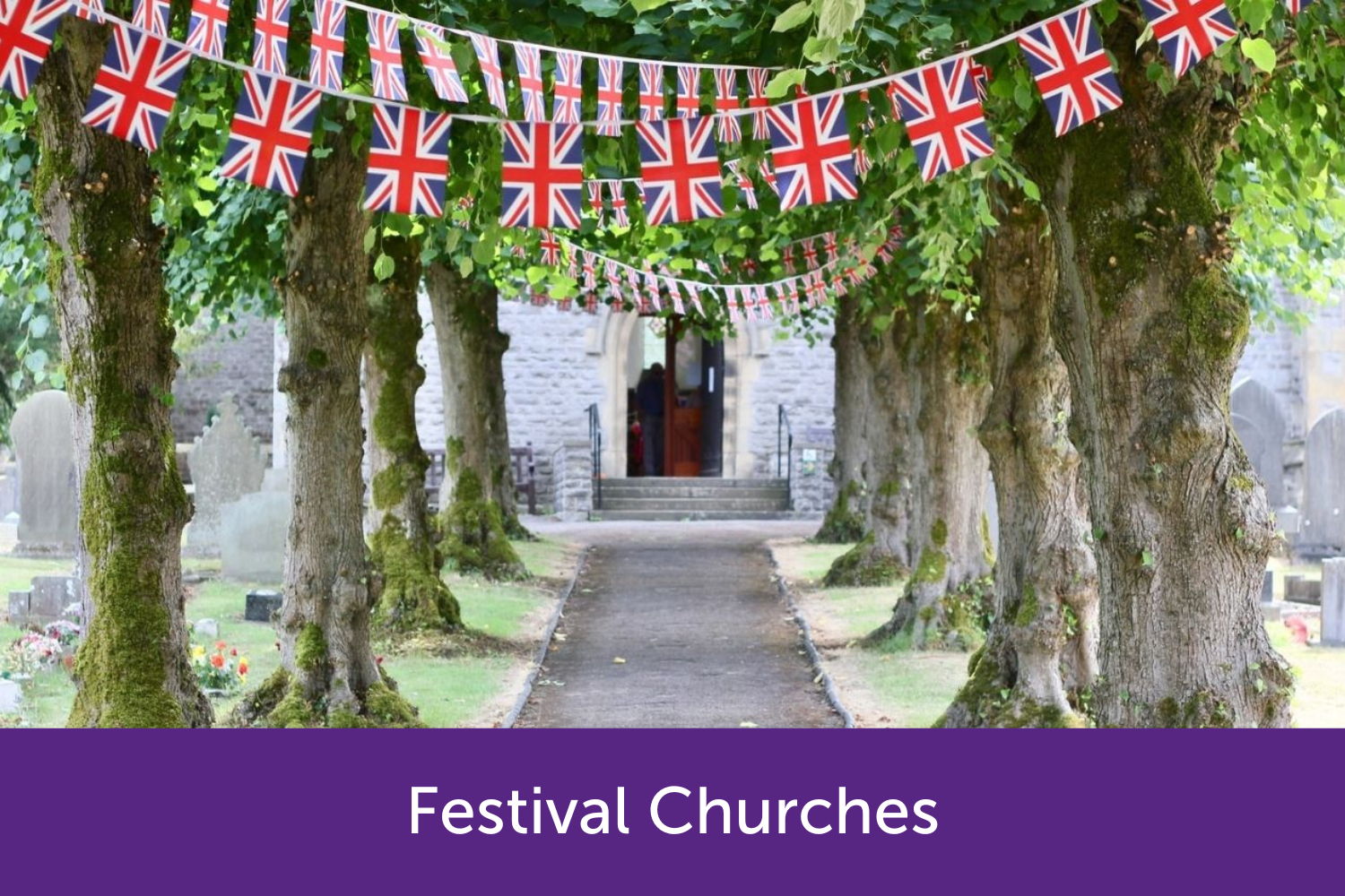 English flags in-between tress leading to a church