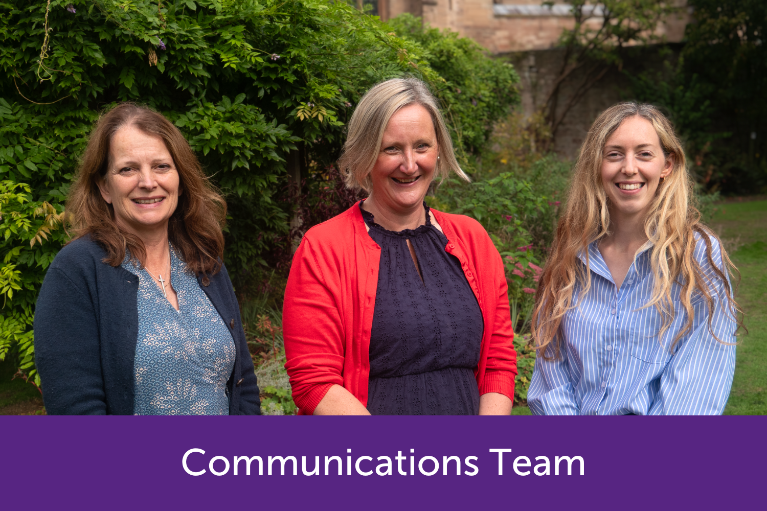 The communications team smiling