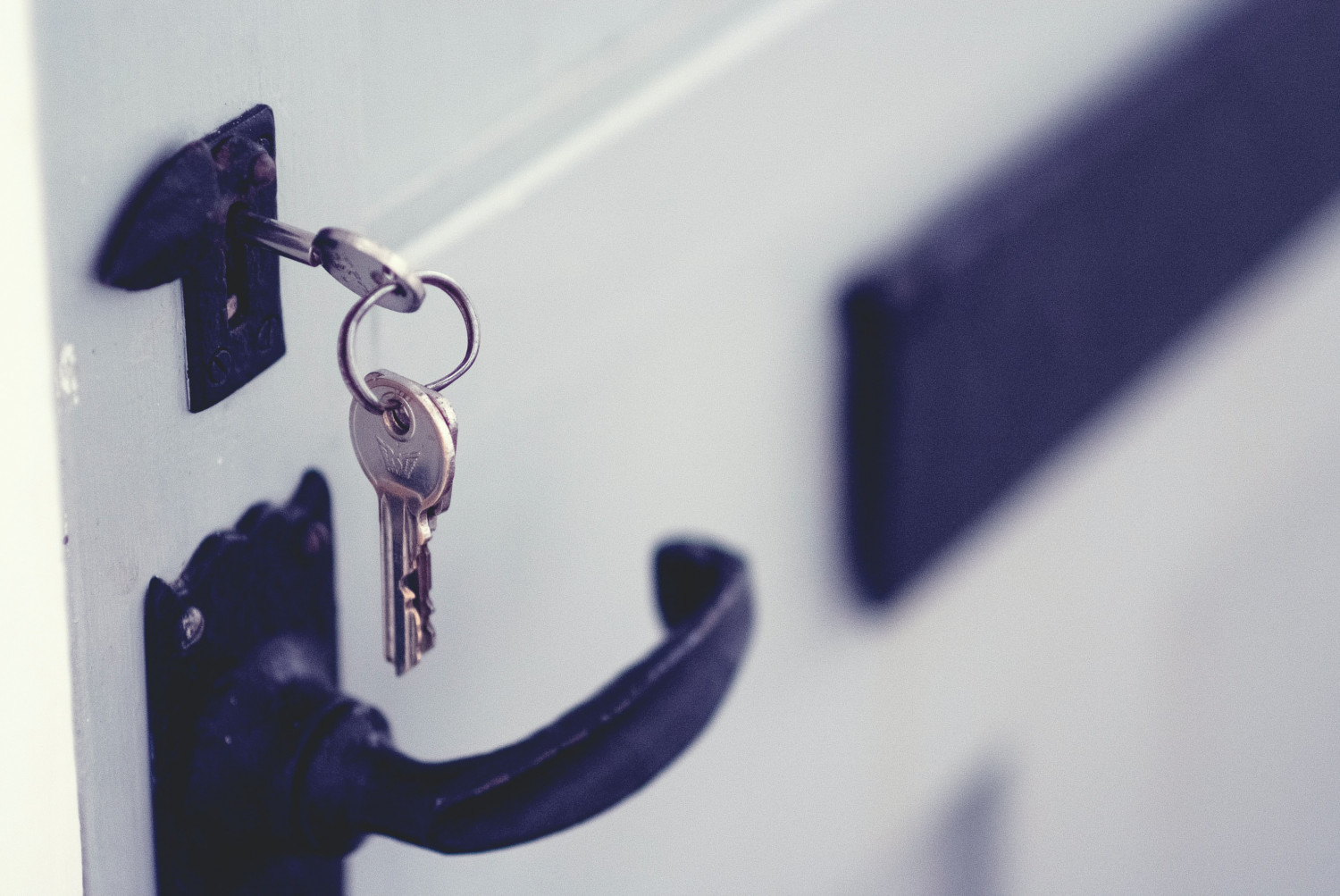 Image of a key in a locked door