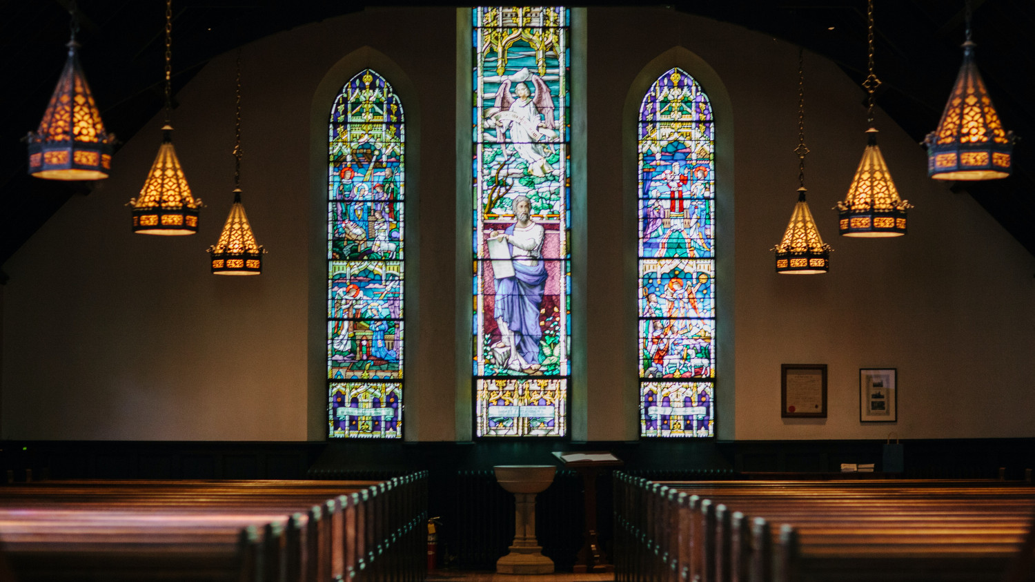 Image of stained glass windows within a church