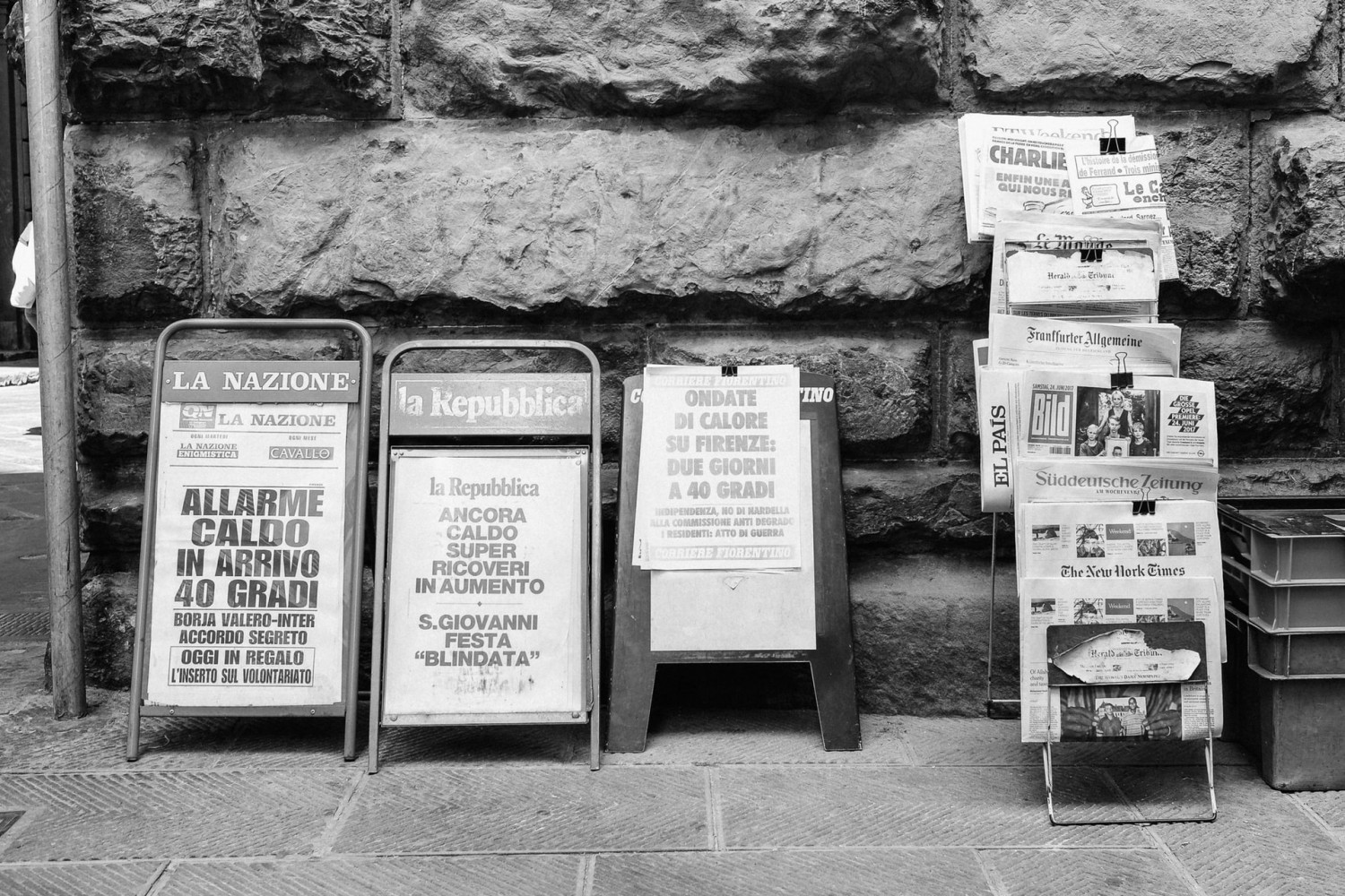 Image of various news stands on a pavement