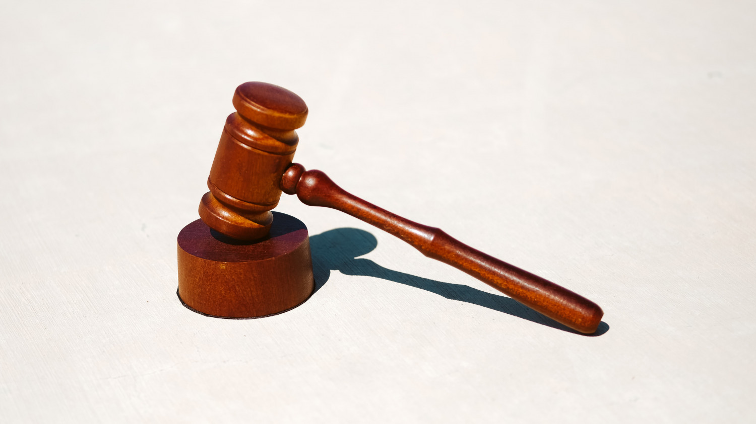 Image of a wooden gavel on a white background