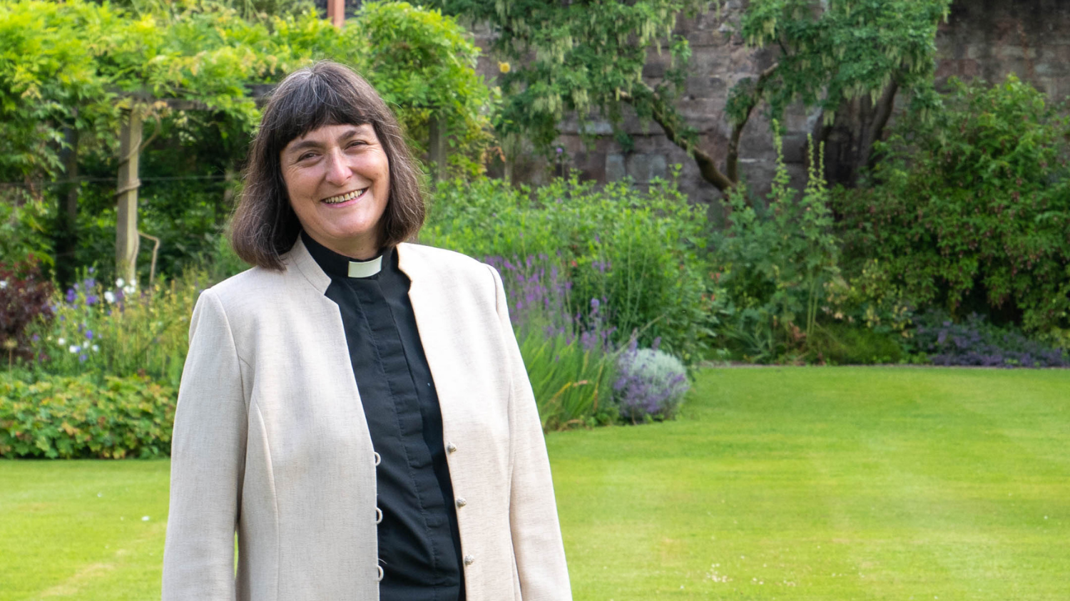 Dean of Hereford The Very Revd Sarah Brown with Hereford cathedral in background