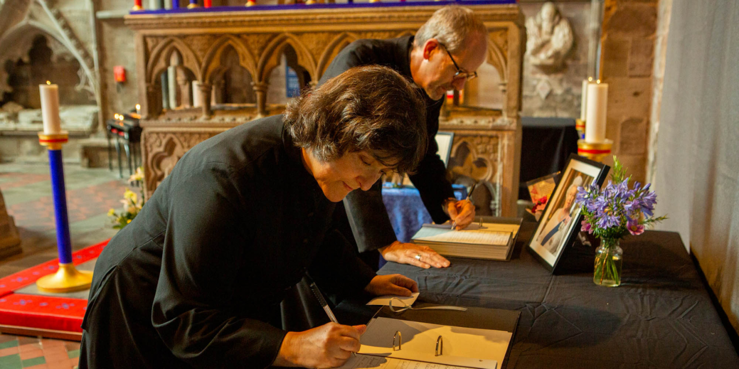 Bishop of Hereford and Dean Hereford signing the book of condolence, Hereford Cathedral