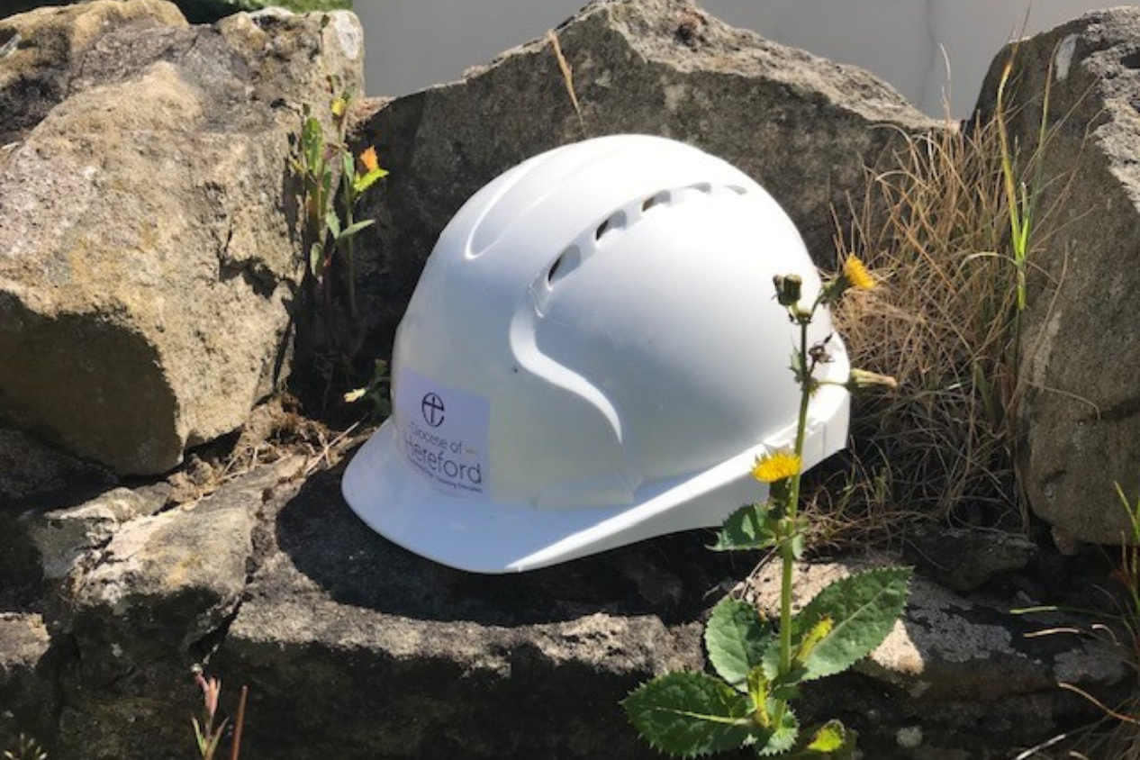 Hard hat perched on stones