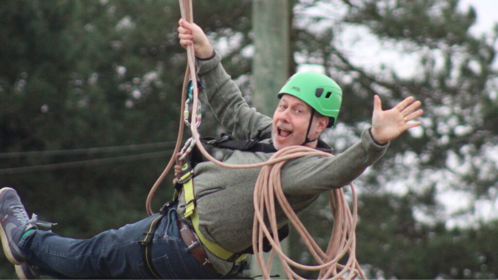 Revd Nick Gurney on a zipline